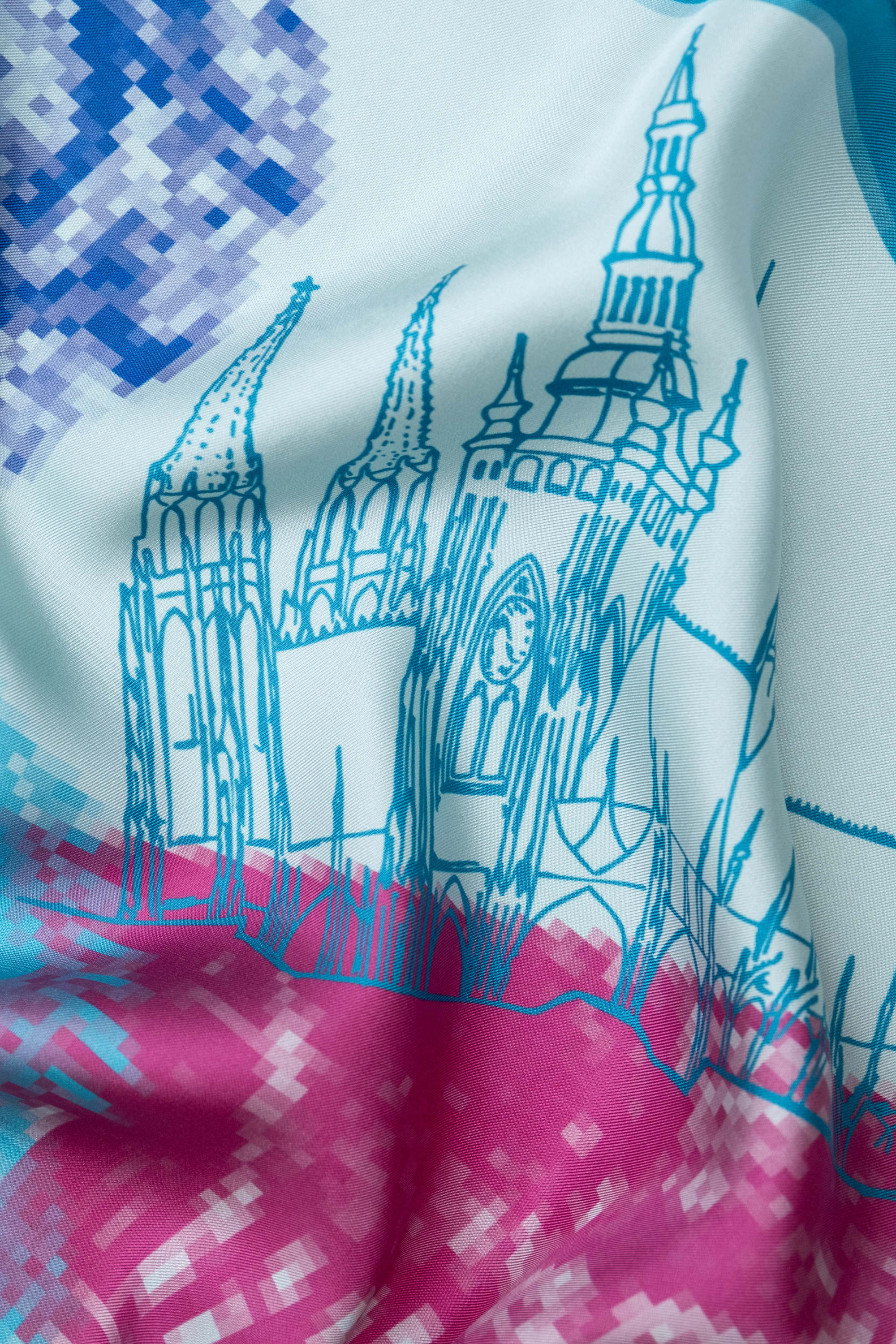 EMBLEMM Square Silk Scarf with Prague Print 'Distorted Prague' with pixelated and hand-drawn Prague Landmarks in Light Green, Pink and Blue Detail